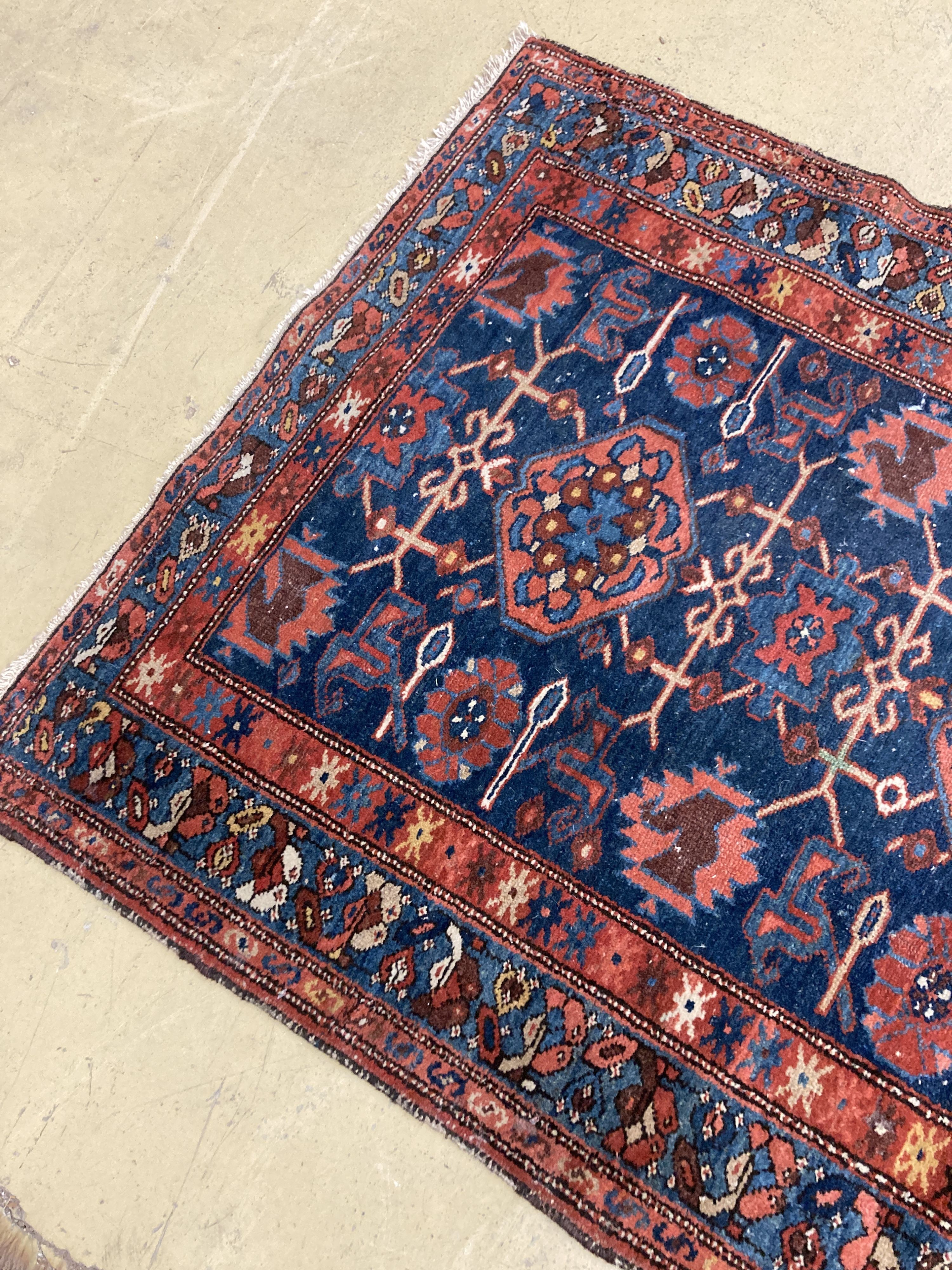 An antique Hamadan blue ground rug, 180 x 104cm